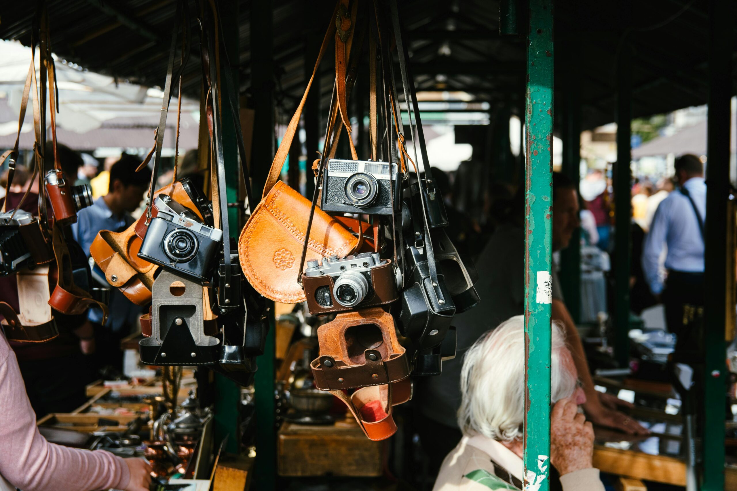 Hanging vintage cameras at an outdoor market in Kraków, Poland.